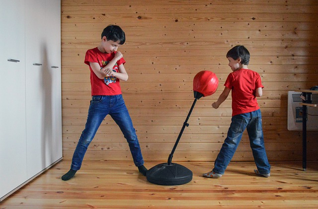 Two kids are practicing boxing.